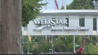 Nurse working with Atlanta Medical Center employees to help them with next steps