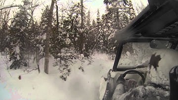 Polaris Rzr XP 1000 snow ride in the woods