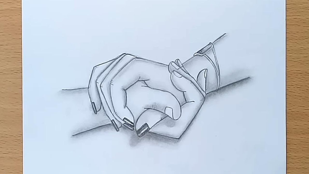 hand holding pencil drawing