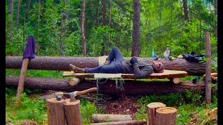 Bushcraft swamp camp. A new way of splitting logs along. Sleeping bench. No talking