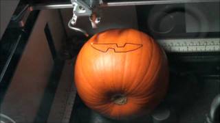 Halloween Pumpkin jack o'lantern getting carved with a Laser Engraver Happy Halloween