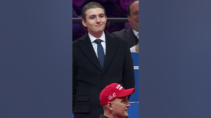 Barron Trump reacts to the crowd after dad acknowledges him at inauguration