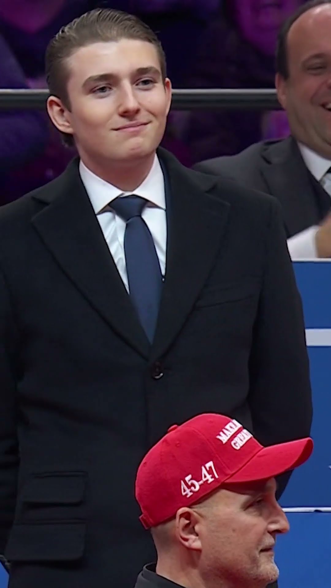 Barron Trump reacts to the crowd after dad acknowledges him at inauguration