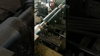 Roller manufacturing machine, roller processing machine, roller production line