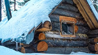 THE COMFORT OF A TINY LOG CABIN IN BAD WEATHER OFF GRID