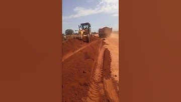 Dumping and spreading marram on going#road#caterpiller#caterpillar #roadconstruction #shorts#grader