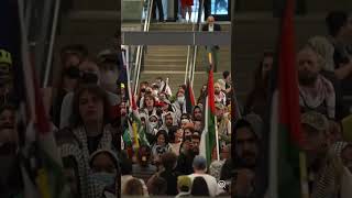 Hundreds hold pro-Palestine protest at railway station in Toronto, Canada