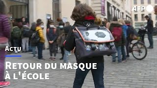 Covid: retour du masque dans les écoles primaires en France | AFP