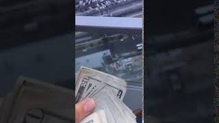 Throwing Money From A Skyscr