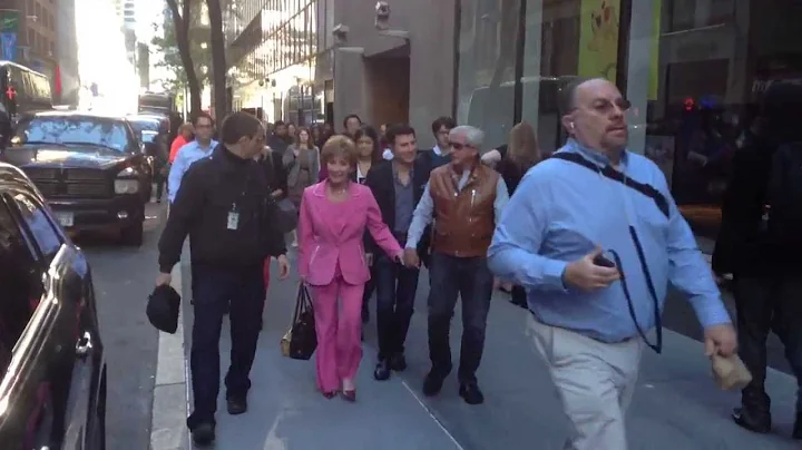 Judge Judy holding hands while leaving NBC studios