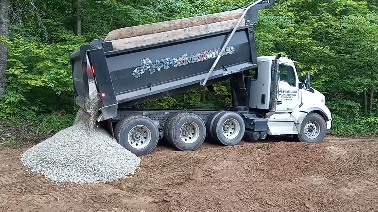 dump truck dumping rocks. YouTube