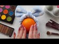 Asmr oddly satisfying skincare and makeup on orange