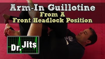 Arm-In Guillotine from the Front Headlock Position | Dr Jits | Guest: John Evans | Host: Amechi