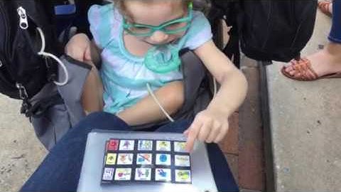 Harper and Mom talking using a mini PODD