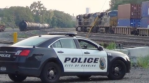 Police Protect Railroad Crossing as CSX Train Goes By