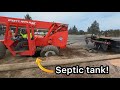 20,000 pound machine falls into septic tank!