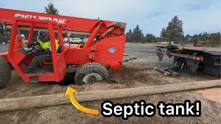 20,000 pound machine falls into septic tank!