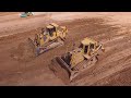 *Teamworking* Cat D9R and D8N pushing dirt - Drone video