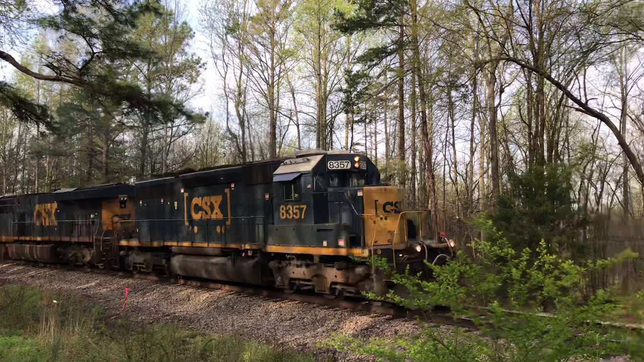 CSX 8357& 941 running CSX track maintenance equipment train