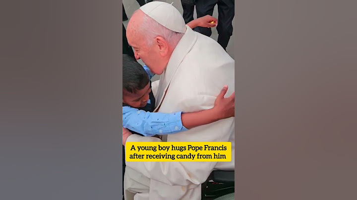 A heartwarming moment: A young boy hugs Pope Francis after receiving candy from him #popefrancis