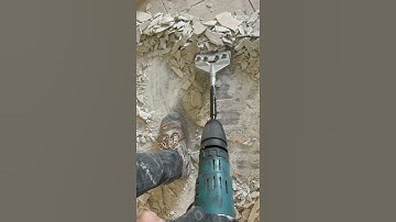 Removing tile with a Makita Demolition hammer and tile removal bit