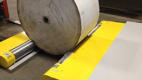 After market, floor mounted paper roll squaring and stripping station