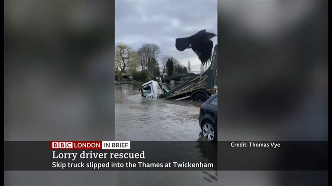 Skip truck slips into the water lucky escape for the driver (UK