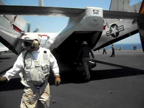 Chip Shively and Brad Blackburn walking to the COD Plane to take off from the USS Eisenhower 2010