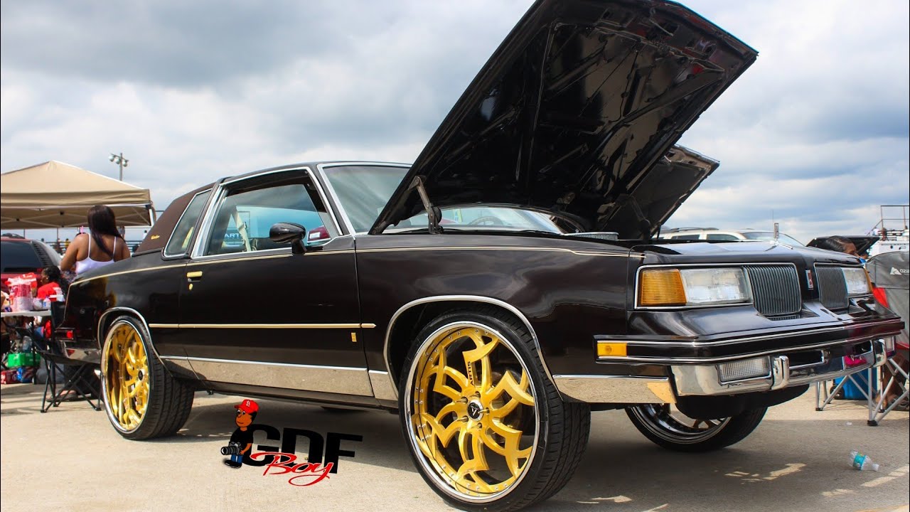 Brown Oldsmobile Cutlass Supreme on Brushed Gold Artis Medusa 24s at King Of the Streets.