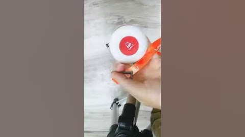 how to open the back of the button and attach the strap