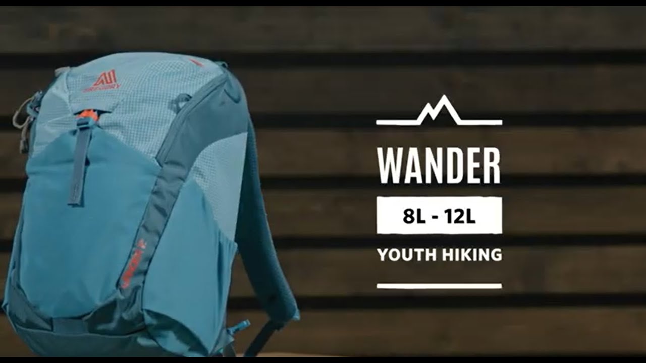 gregory backpacks for youth Kid's Wander 12L Hiking Backpack and a rain jacket close by Gregory Mountain Youth Wander 70