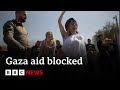 Israeli protesters block food convoys for starving civilians in Gaza | BBC News