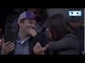 Mila Kunis and Ashton Kutcher sitting courtside 2012