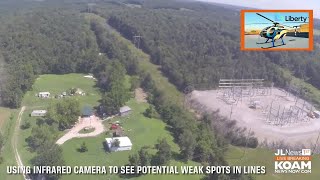 Low-flying helicopter is inspecting power lines