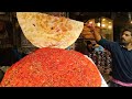Pakistani street food in lahore  lahori katlama  deep fried dessi pizza  street food 