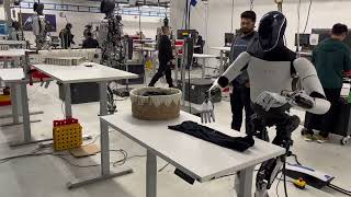 Tesla Bot Optimus is folding laundry!