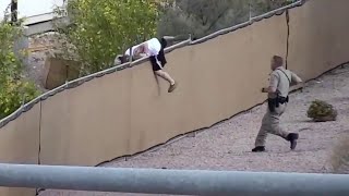 Officer jumps over fence to catch suspect
