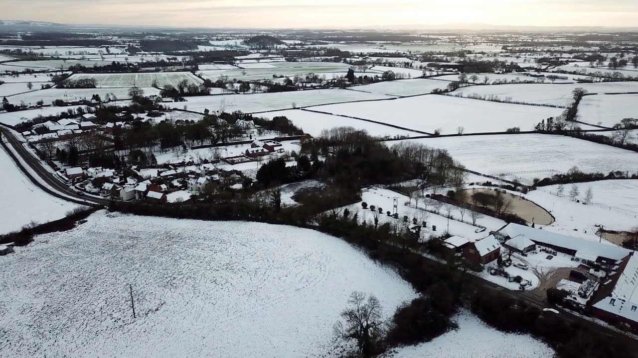 Snow covered Hanbury village flyby, Worcestershire, UK