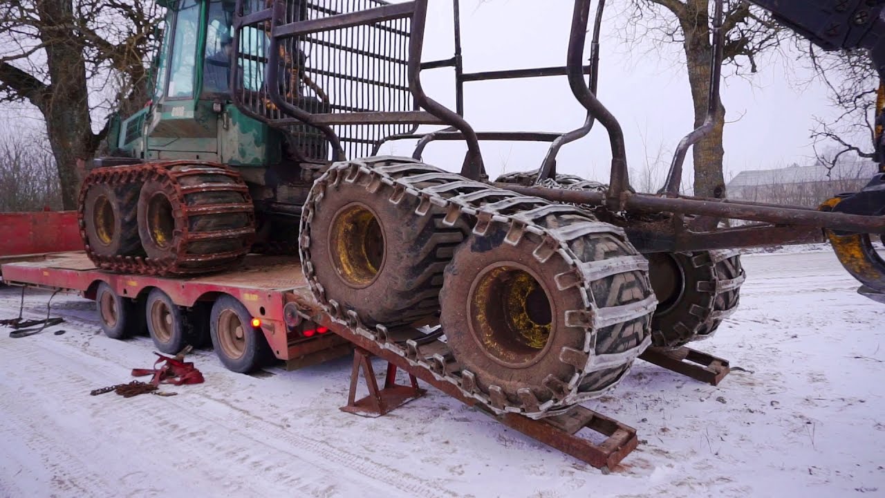Timberjack 810B logging in winter forest