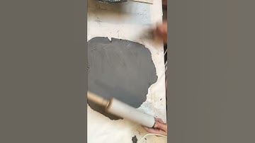 Rolling out a slab of clay