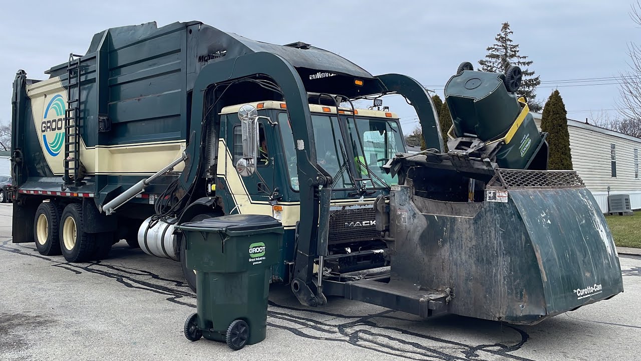 Groot Mack LE McNeilus Pacific Curotto Can Garbage Truck in a Trailer Park