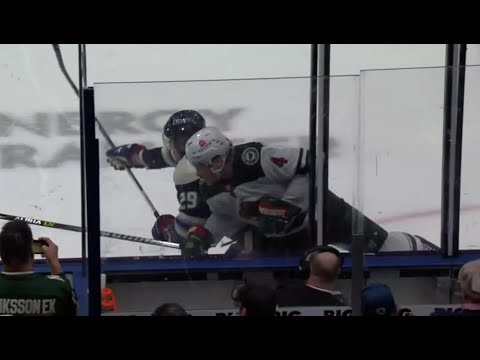 Patrik Laine throws a hit on Jon Merrill