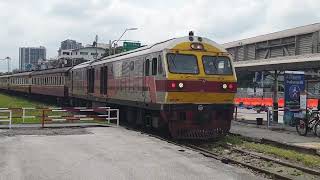 A long-distance train arrives at Bang Sue Junction, Bangkok heading for Thailand's deep south.