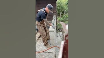 Setting top cap on a concrete block wall. #cmublock #structural #masonary