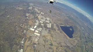 Wingsuit above plane (skyvan)