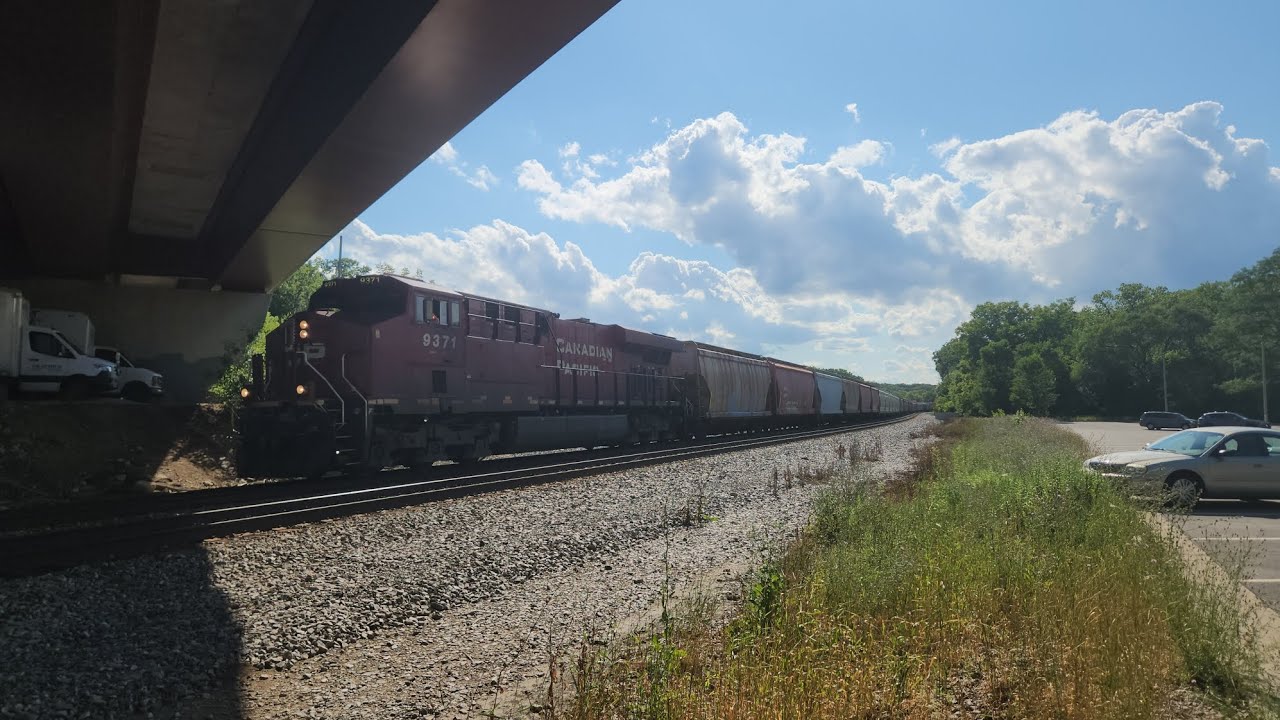 CP 9371 leads a CP Sand train on Canadian Pacific's Watertown Subdivision|7/29/23