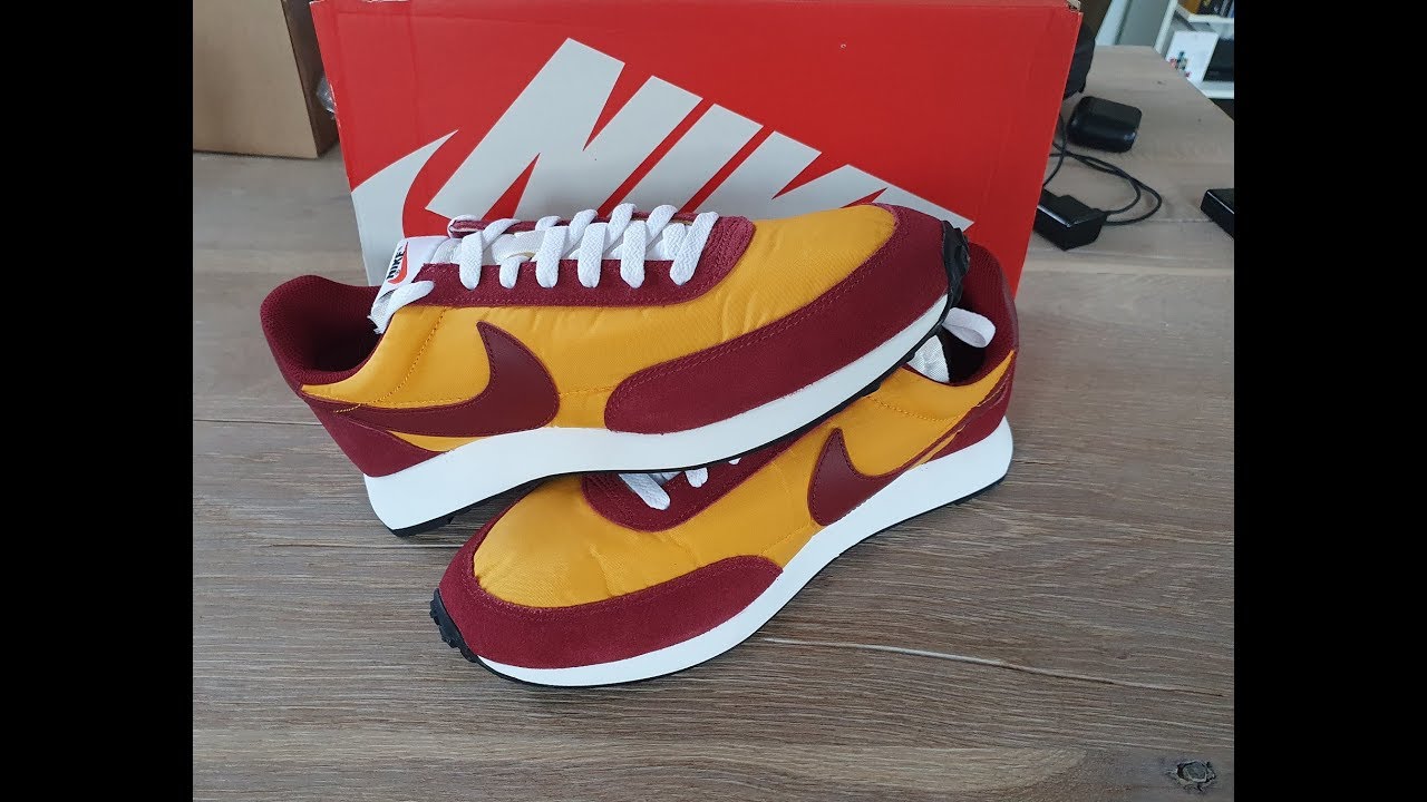 nike tailwind university gold