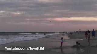 Bell Super Cobra (AH-1W) buzzing the beach