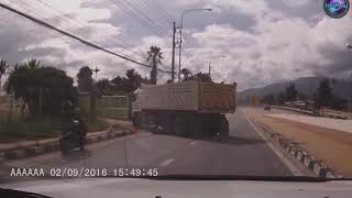 Motorcycle Rider Falls Under Truck And SURVIVES