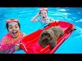 TEACHING TIANA'S PUPPY HOW TO SWIM!! Cute Puppy Videos